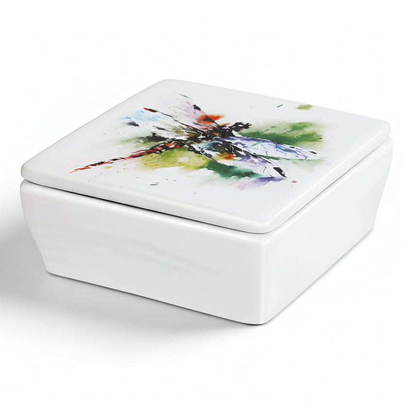 A ceramic vanity box with a lid featuring a watercolor-style dragonfly design by Dean Crouser.