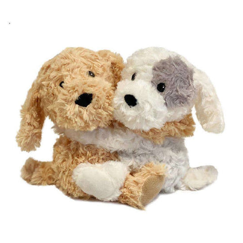 A golden dog and a white dog with one grey spot on the left eye Warmies Hugs made with real lavender