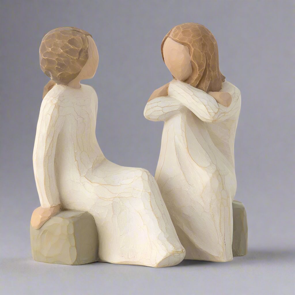 The Willow Tree Heart and Soul Figurine by Susan Lordi features two friends sitting next to each other as they have a deep and heartfelt conversation. 