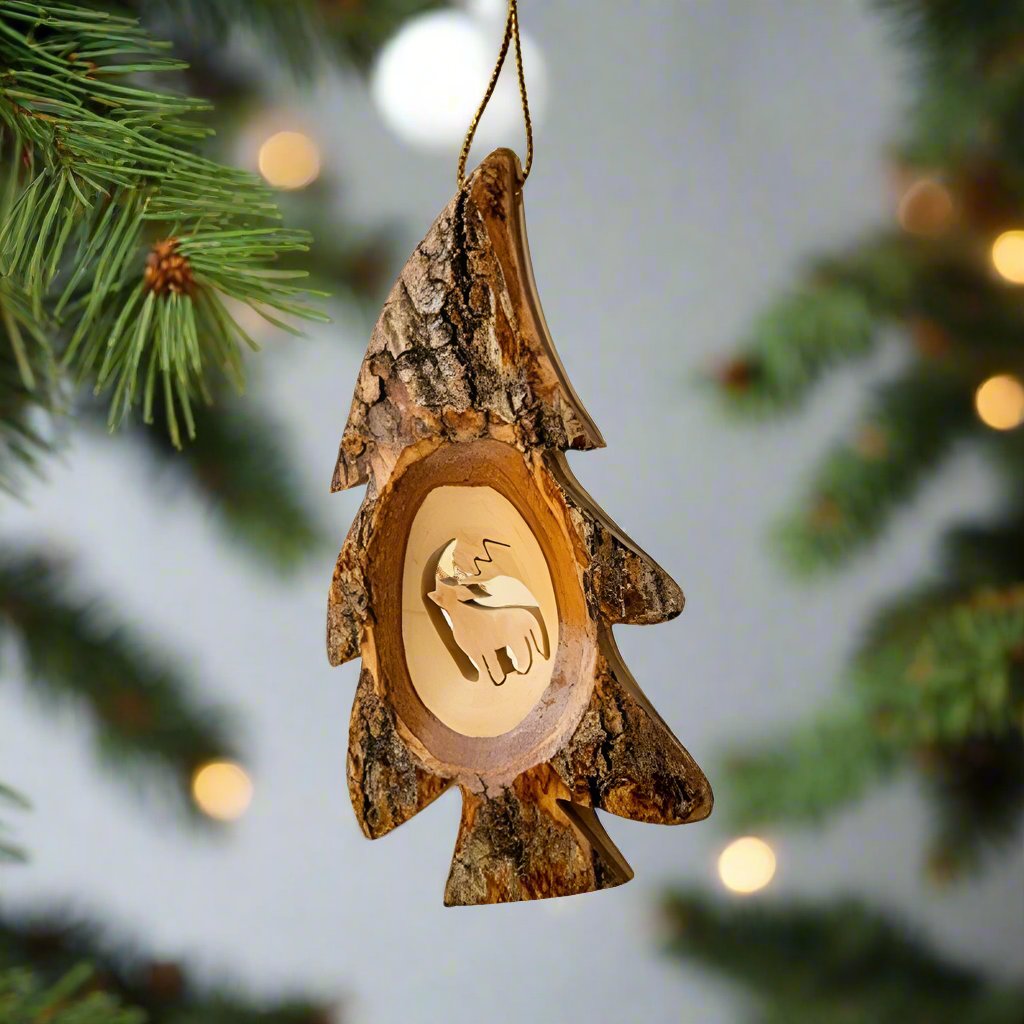  The Wolf Tree Bark Ornament by EarthWood is an adorable tree shaped olive wood ornament with a howling wolf carved in the center. 
