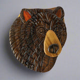 The Wood Carved Black Bear 2 Puzzle Box by The Handcrafted includes a small mechanism that acts as a lock to keep this box together and it stimulates the brain each time you open it.