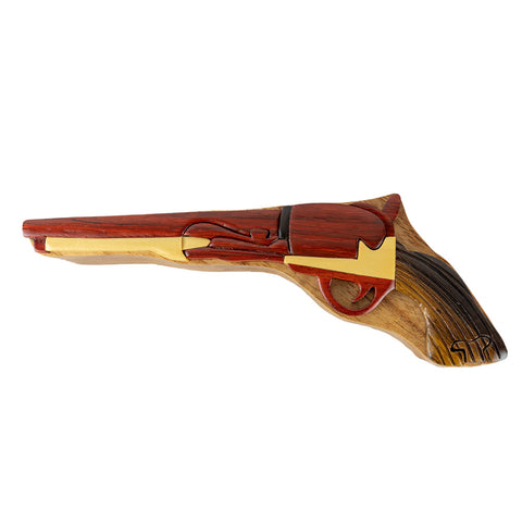 The Wood Carved Gun Puzzle Box by The Handcrafted features a beautiful natural wood box crafted by skilled artisans.
